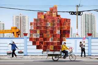 Illustration for article titled Chinese People Pulling Insane Loads